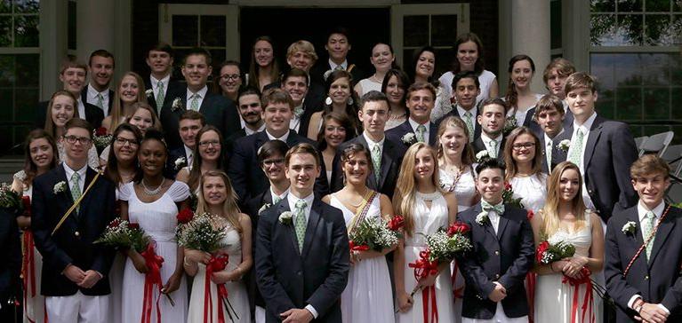 Chase Collegiate students in formal attire pose outside together.